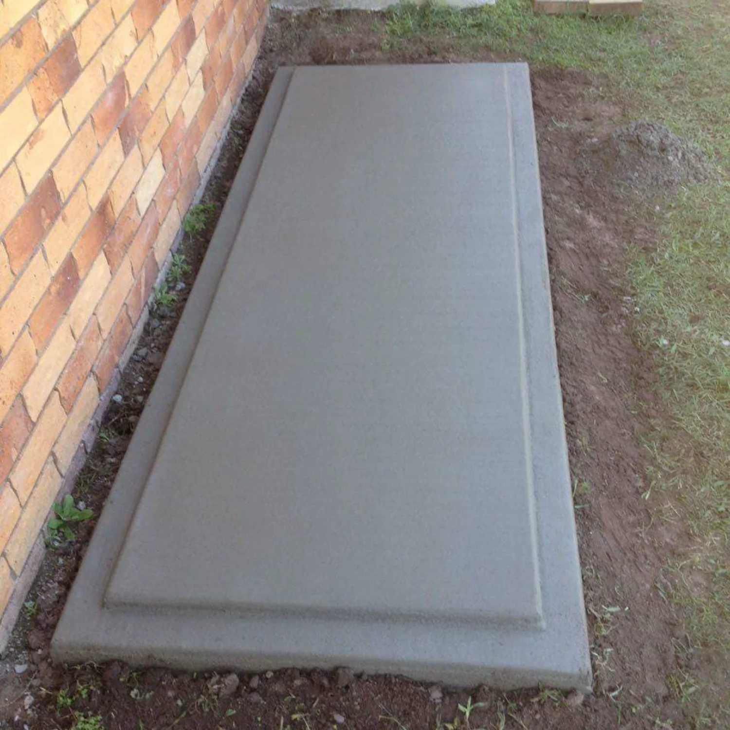 Small concrete slab for a hot water system or tank, poured by Mark Holstein Concreting