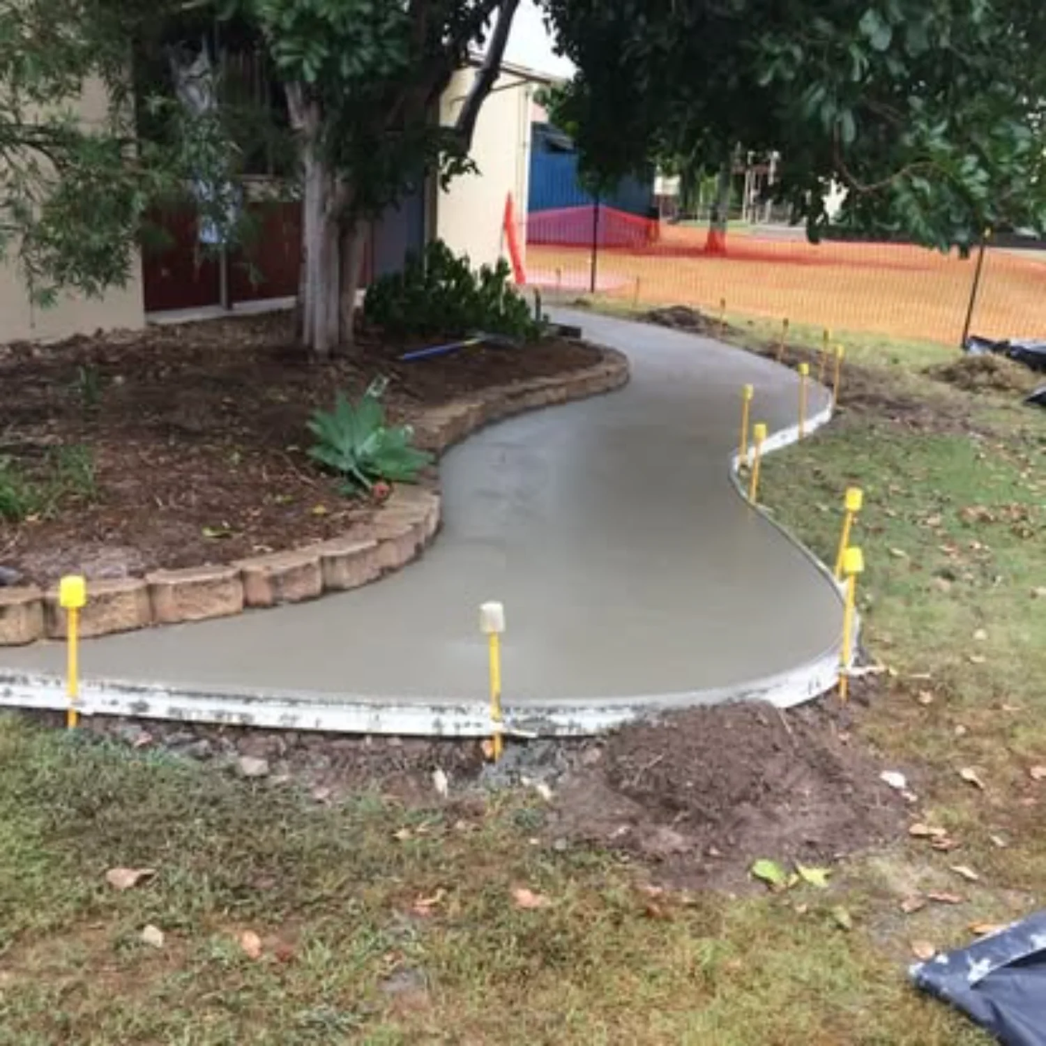 Concrete extension connecting a shed with an outdoor garden area, poured by Mark Holstein Concreting
