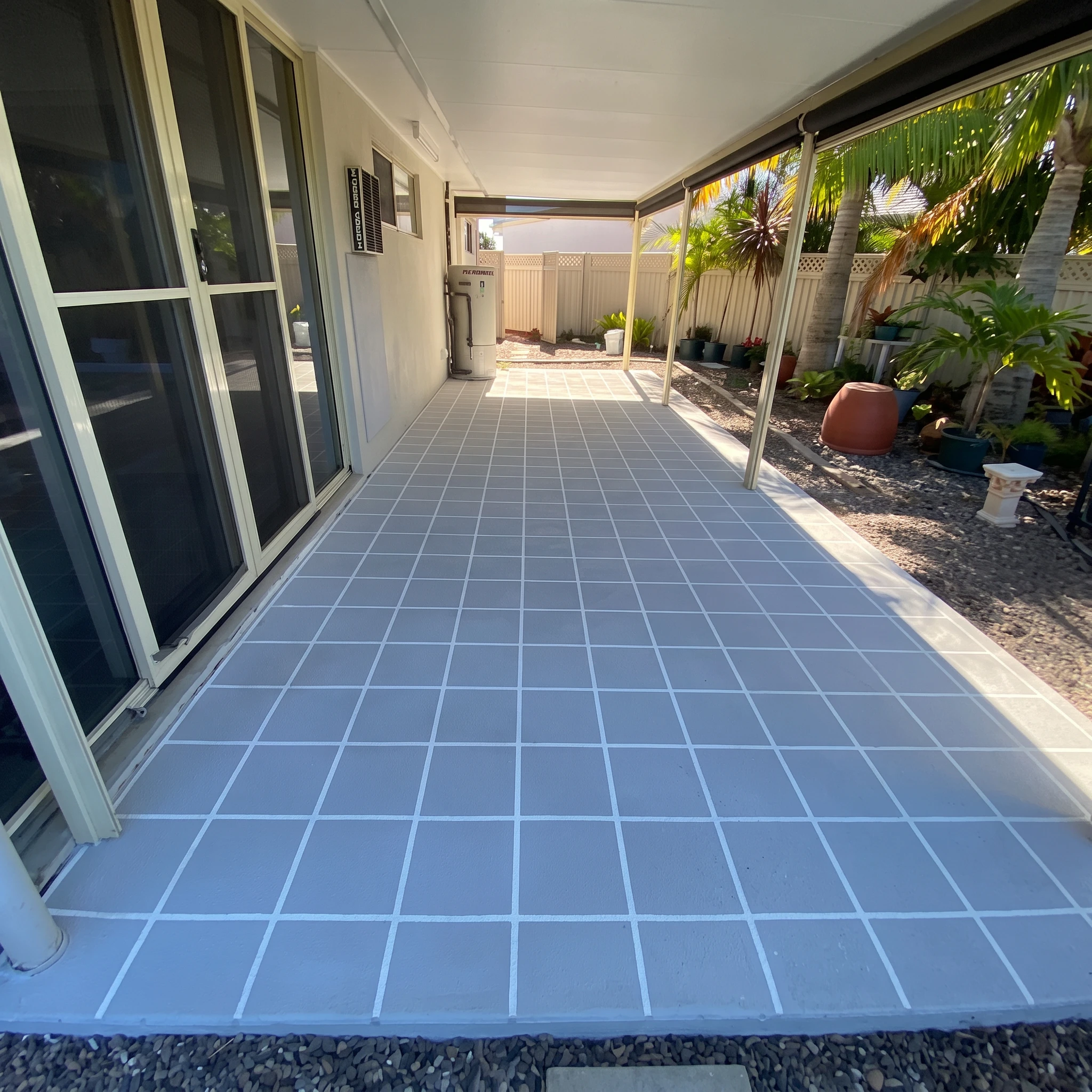 Light grey grid-stencilled concrete patio installed by Mark Holstein Concreting in Hervey Bay
