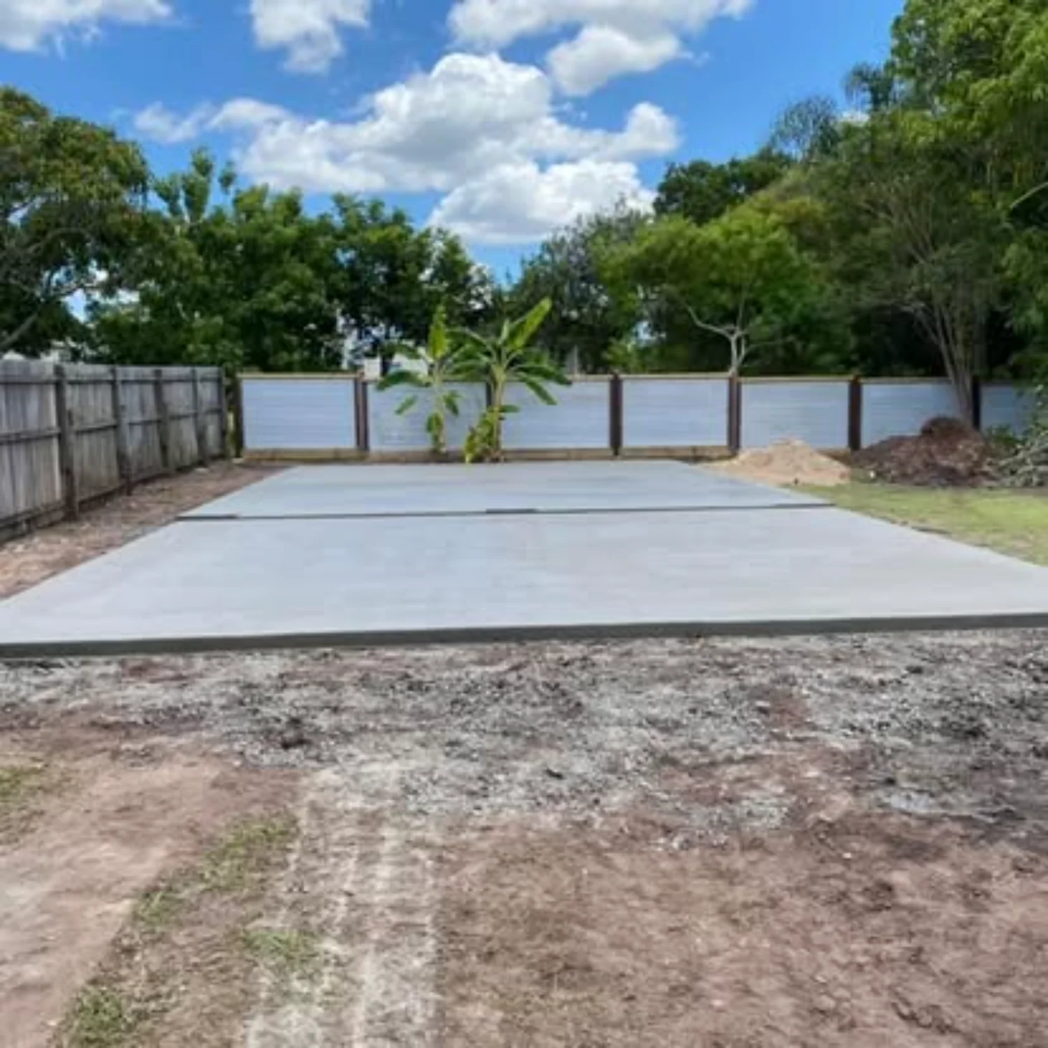 Concrete shed slabs in front of banana trees, recently installed by Mark Holstein Concreting