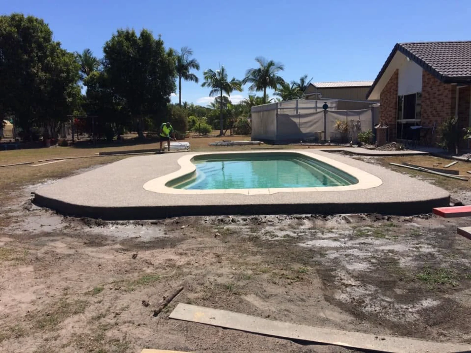 Completed exposed aggregate concrete pool surrounds by Mark Holstein Concreting