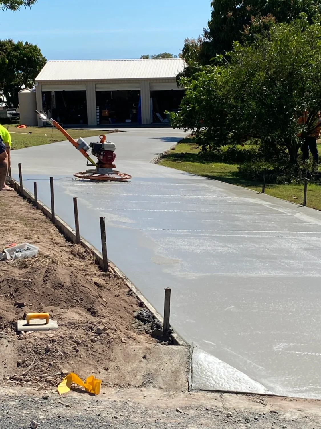 Concrete driveway being poured and finished by the Mark Holstein Concreting team