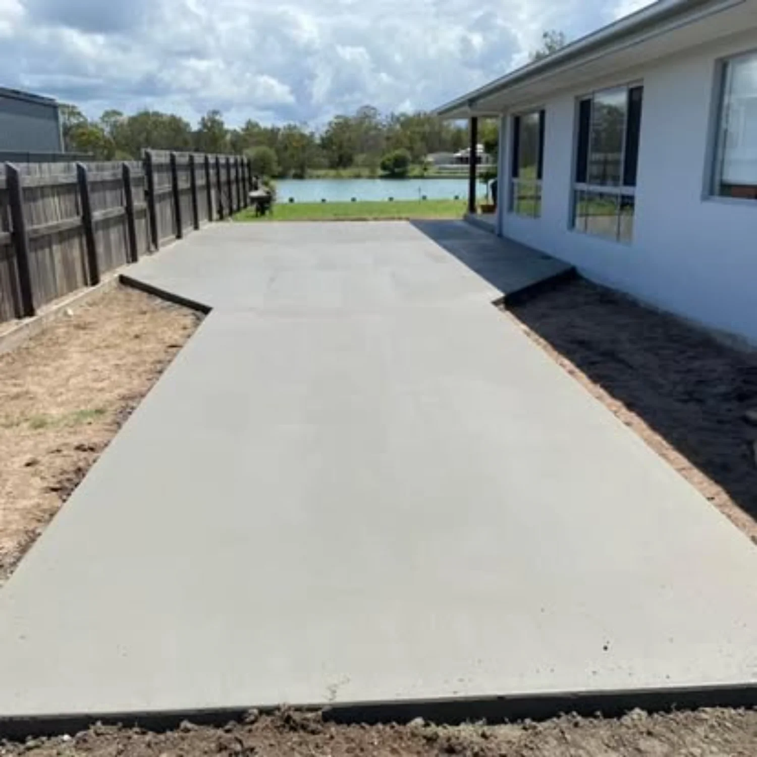 Concrete shed slab next to a waterfront home in Hervey Bay, installed by Mark Holstein Concreting